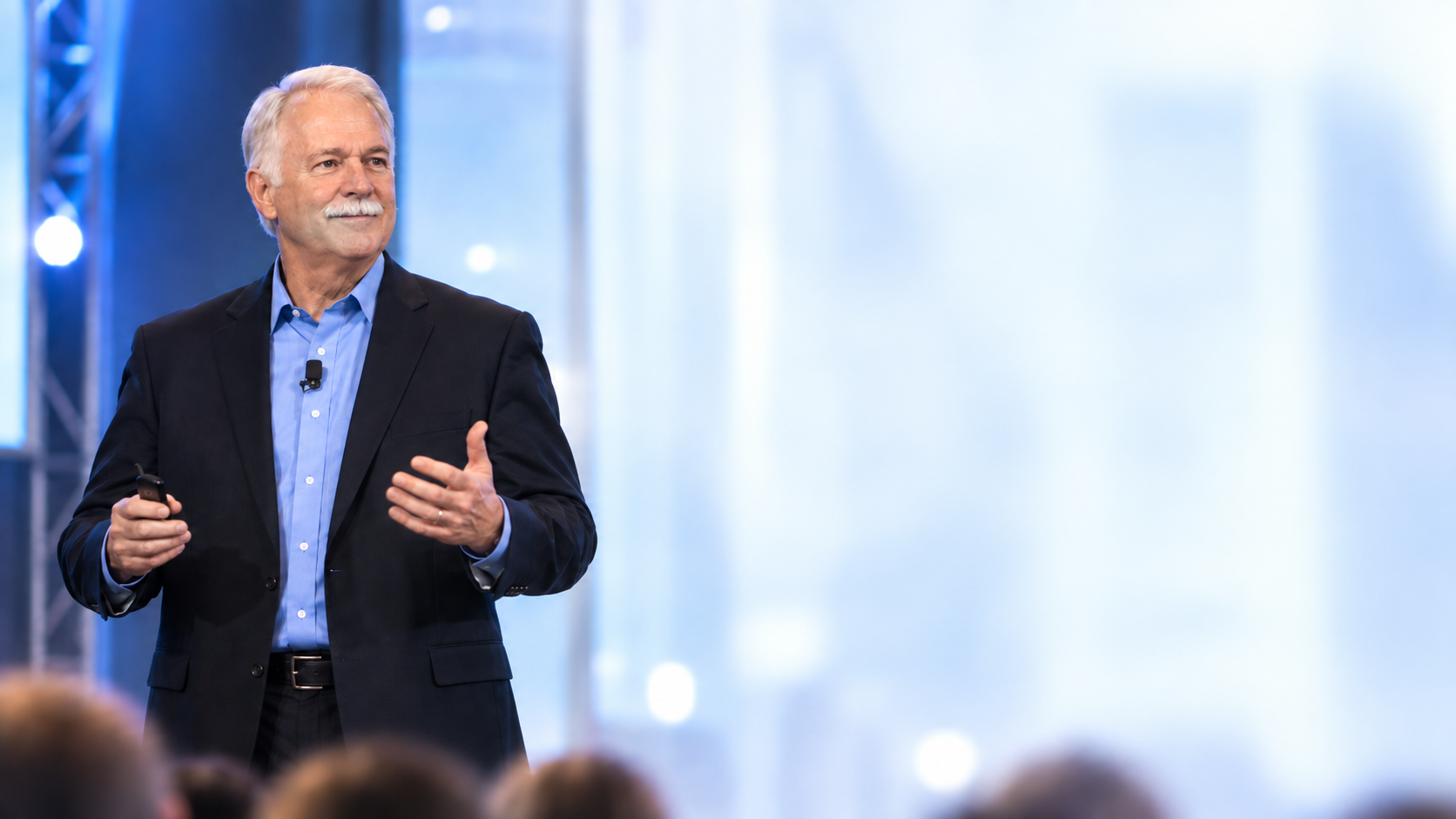 Steve Thornton speaking on stage to an audience